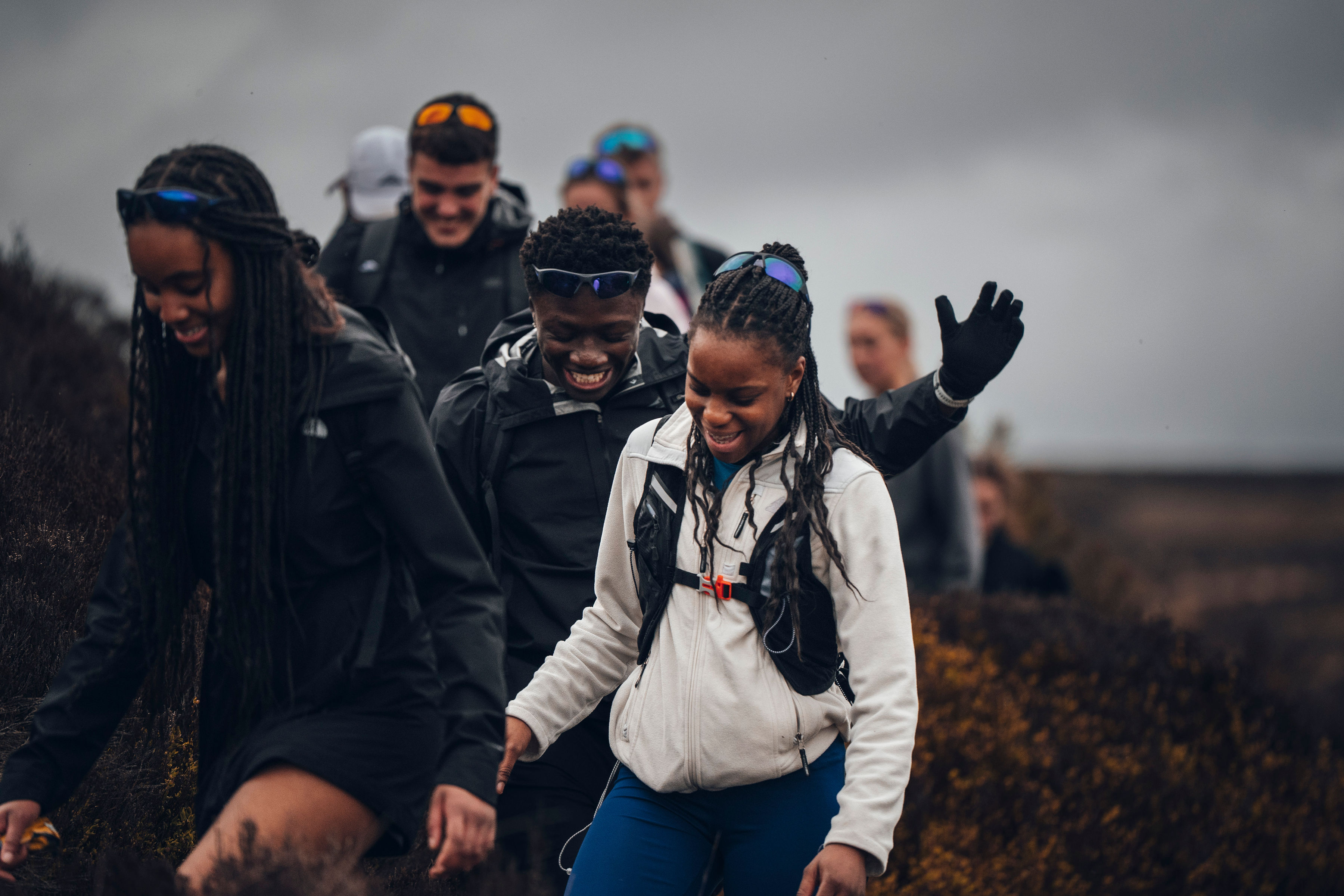 Group of runners training together on a country road
